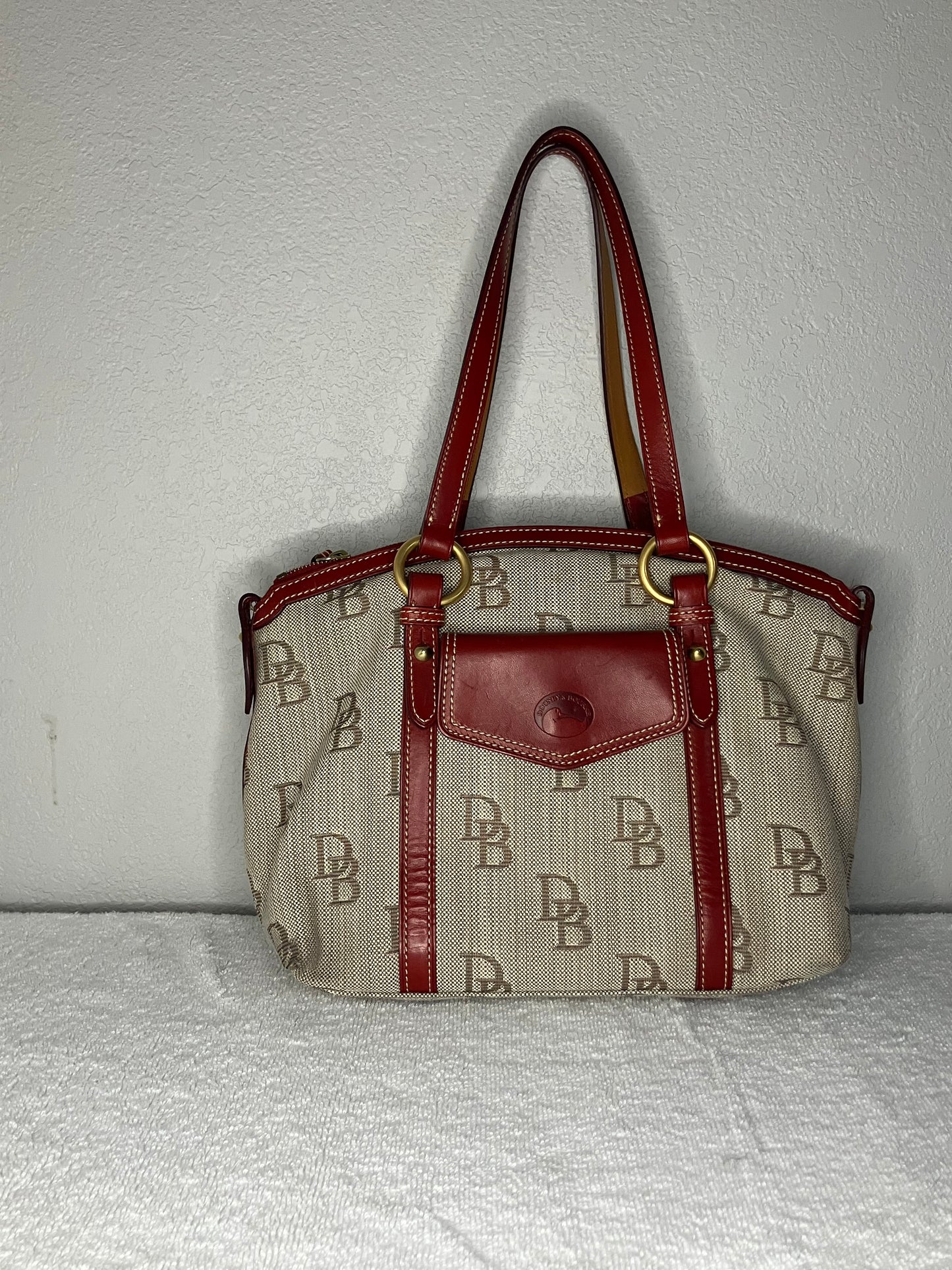 Dooney & Bourke Barrel Pocket Signature Canvas Satchel with Red Leather Trim.