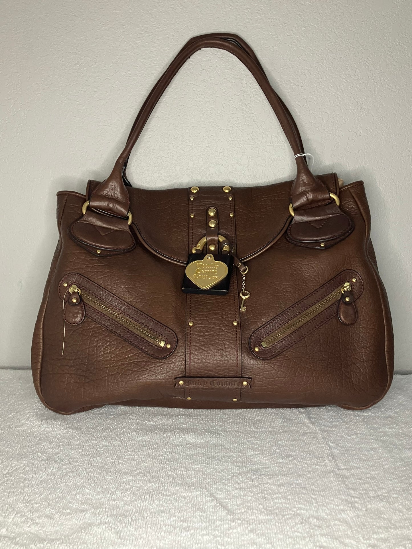 Juicy Couture handbag with a Prominent Heart-shaped Lock and Key Charm