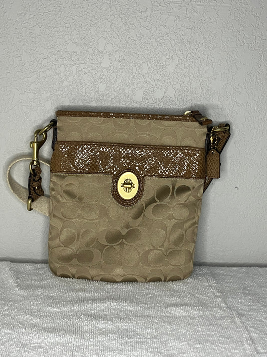 Coach Signature Swingpack Crossbody Bag with a Turnlock Closure and Brown Snakeskin-like Trim